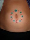 star tattoo on round of navel